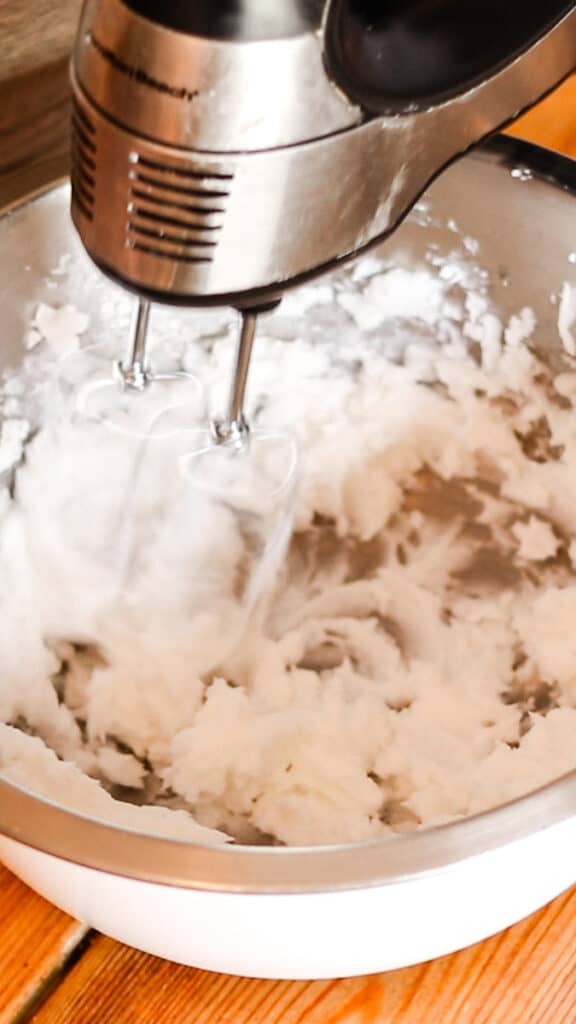 Whipping the bath butter ingredients with a hand mixer.
