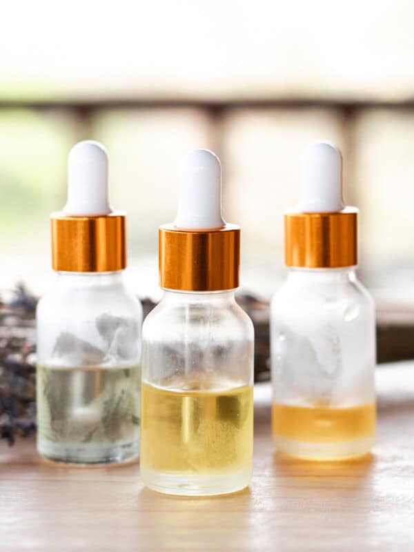 3 face serums with different ingredients in small clear dropper bottles.