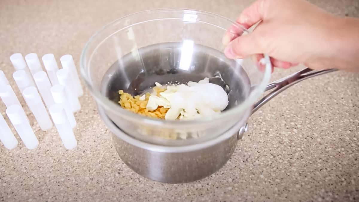 Adding the lip balm ingredients to the double boiler.