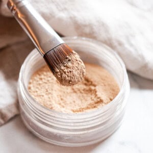 Dipping makeup brush into my homemade mineral makeup powder.