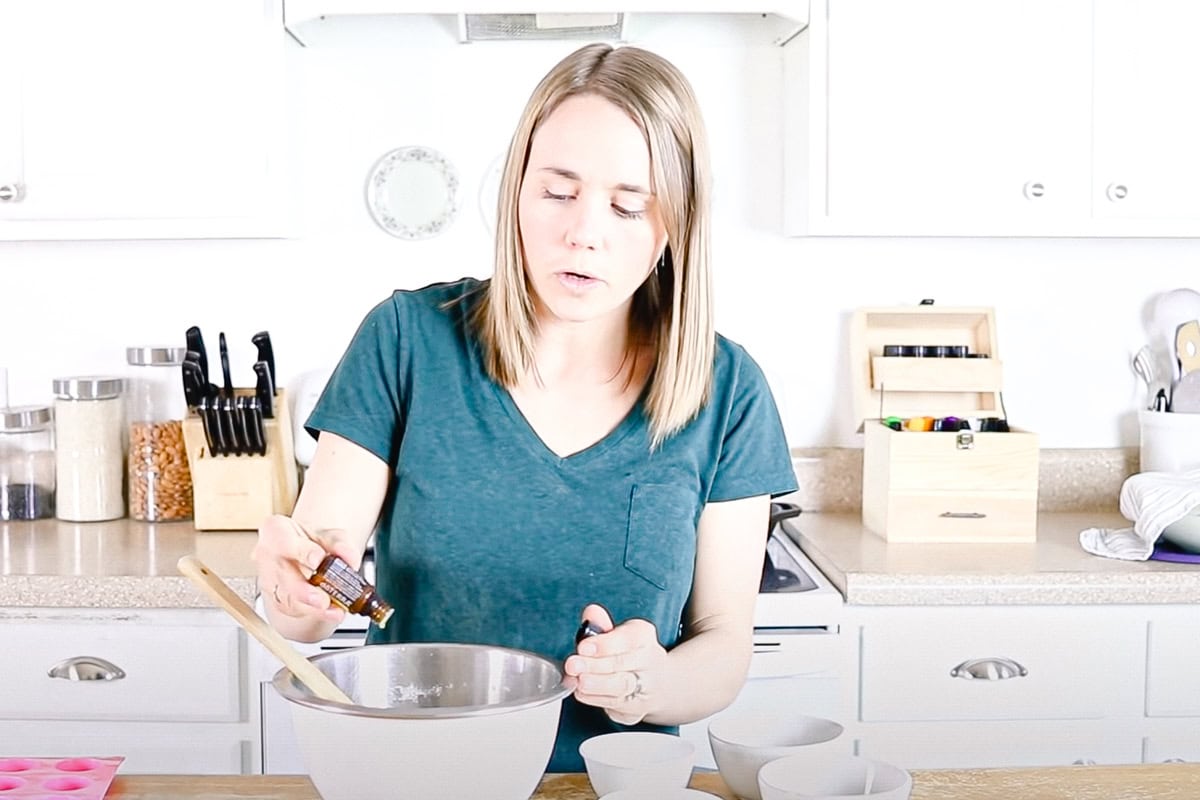 Adding the essential oils to the dry ingredients. 