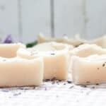 Cold process baby soap bars curing on a white table.