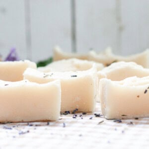 Cold process baby soap bars curing on a white table.