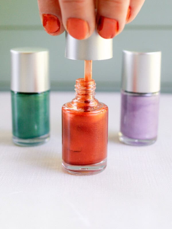 Pulling nail polish out of the tube.