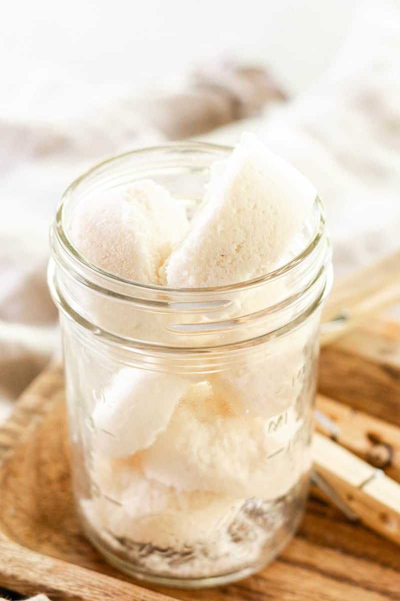 A mason jar filled with DIY laundry soap pods. 