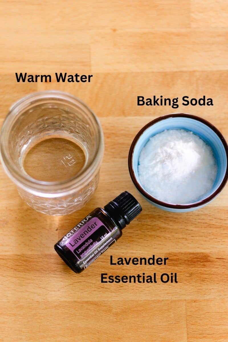 Ingredients for clarifying shampoo: warm water, baking soda, and lavender essential oil.
