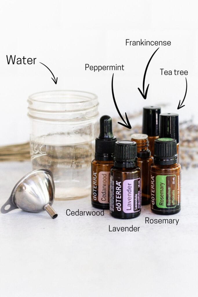 Ingredients to make hair growth spray: cedarwood, lavender, peppermint, frankincense, tea tree, and rosemary essential oils and water.