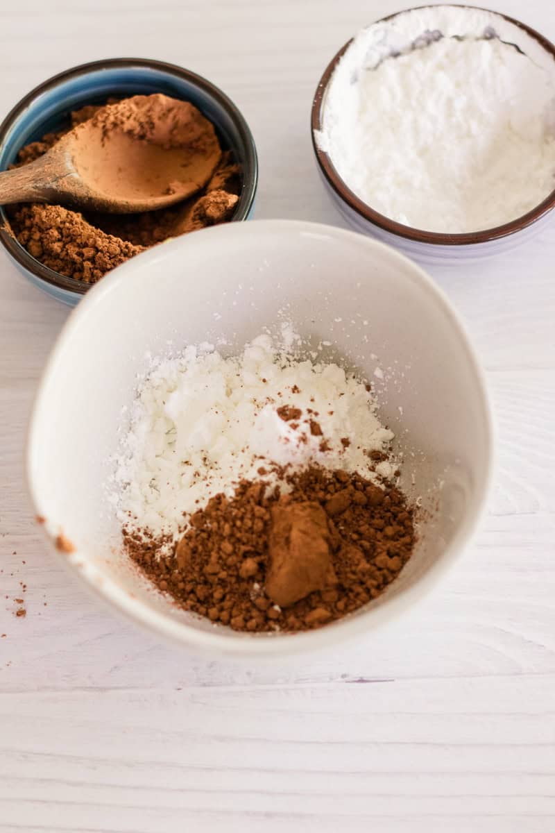 Arrowroot powder and cocoa powder in a small bowl to make dry shampoo. 