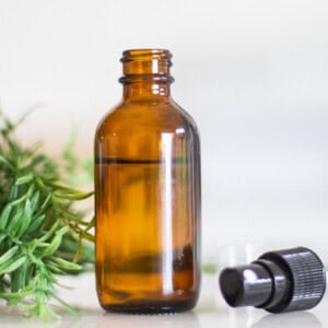 An amber bottle with ant repellent in it.