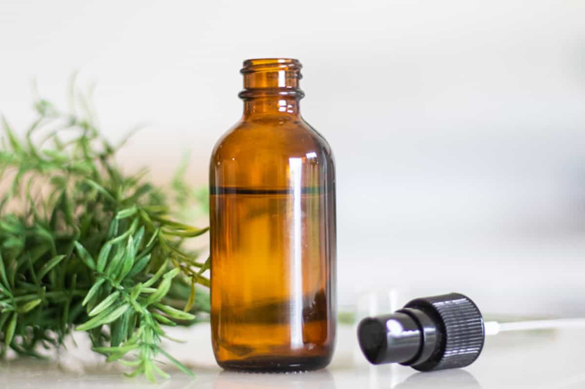 An amber bottle with ant repellent in it. 