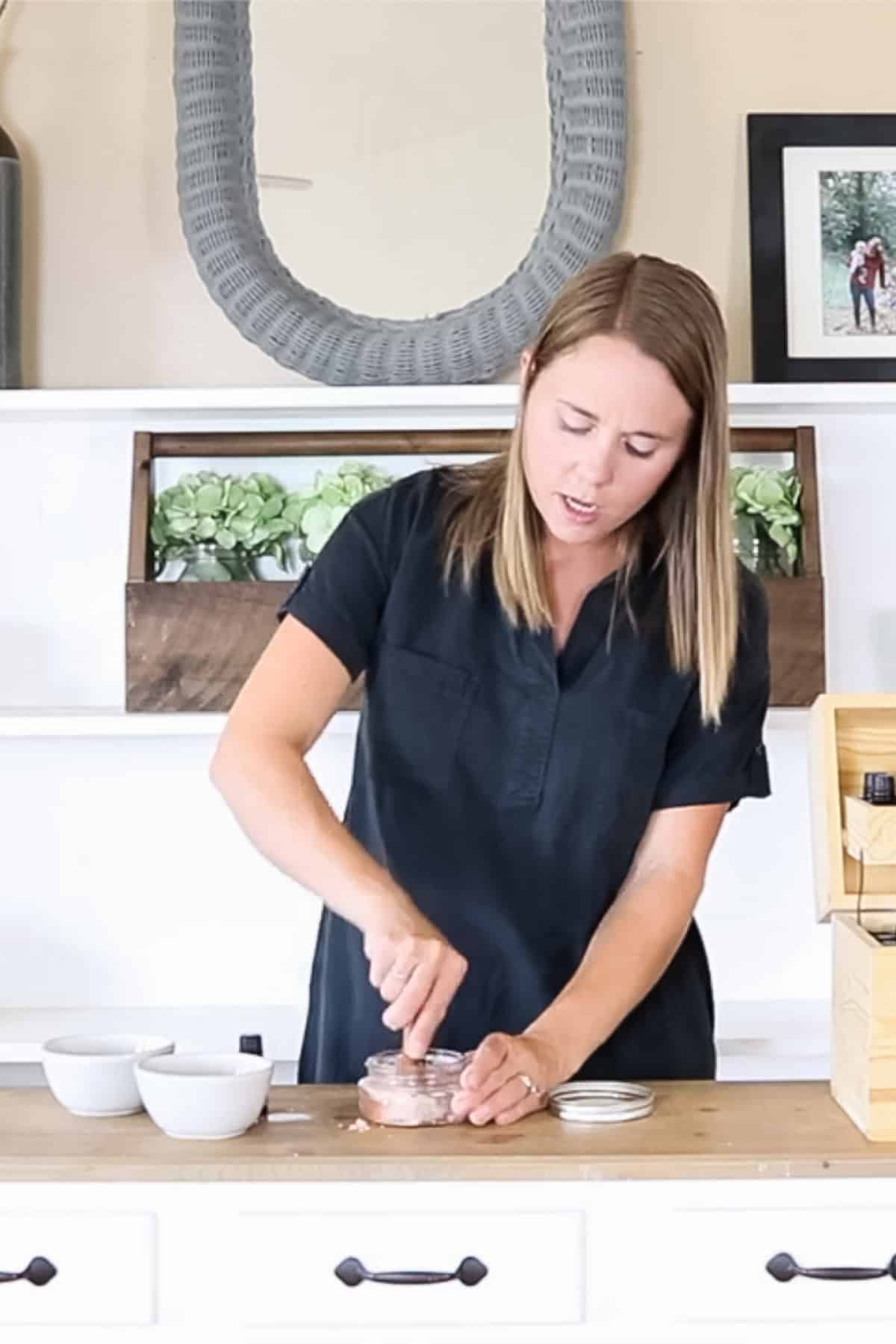 Stirring the oil and salt together with a metal spoon.