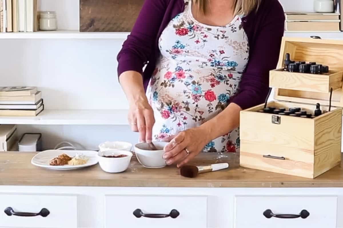 Stirring ingredients together to make DIY foundation.