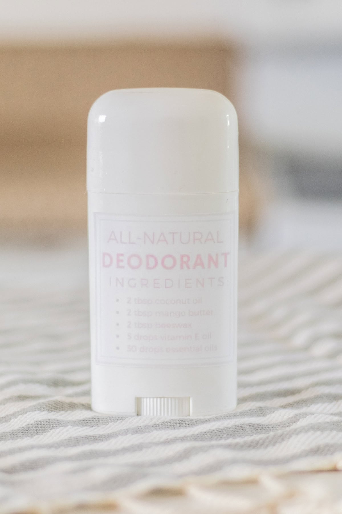 Baking soda free deodorant in white deodorant container with a hand printed label on the side.