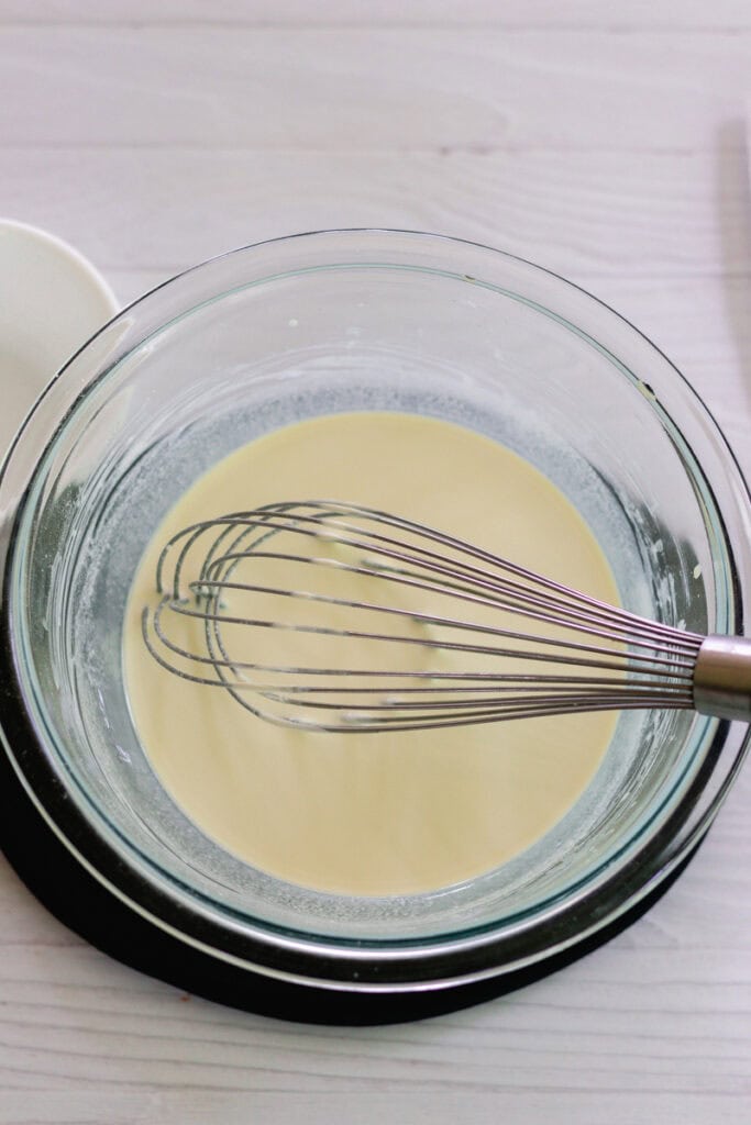 Adding in the non nano zinc oxide and whisking it in with a metal whisk. 