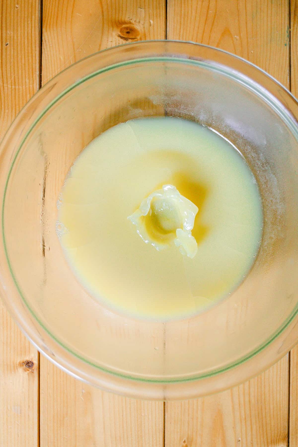 A bowl of chilled body butter with a finger print in it to show the consistency. 