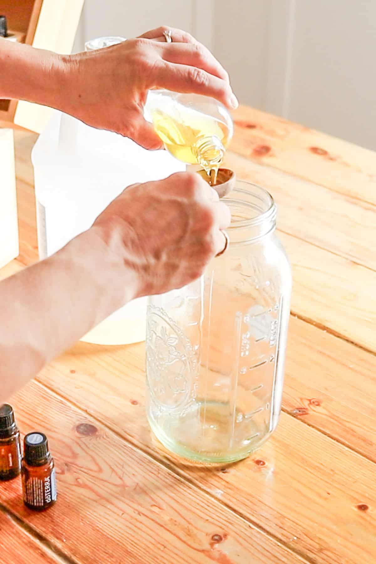 Adding neem oil to the spray bottle. 