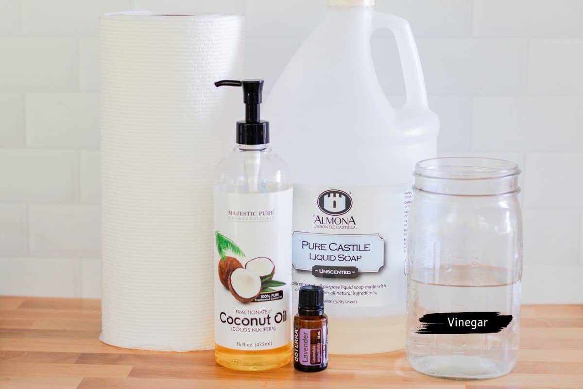 Homemade baby wipes ingredients assembled on a wooden countertop.