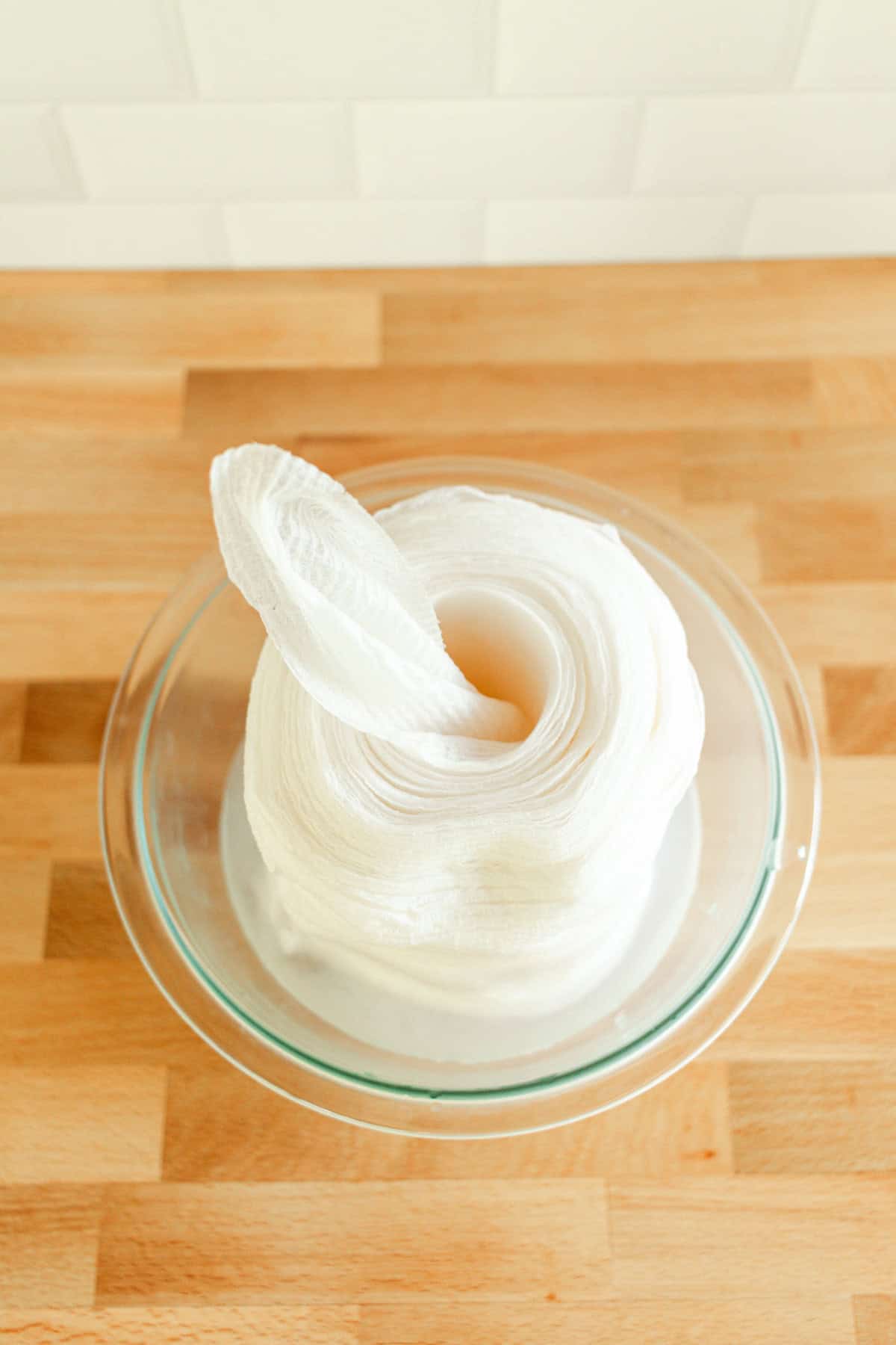 A roll of baby wipes with the center wipe pulled out of the middle.