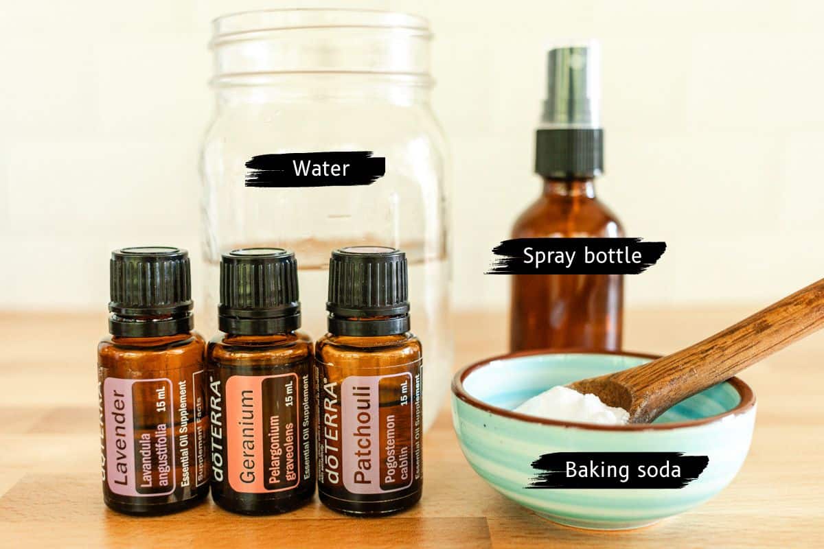 Homemade febreze ingredients assembled on a wooden table.