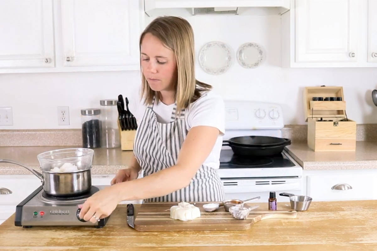 Laura melting ingredients in a double boiler.