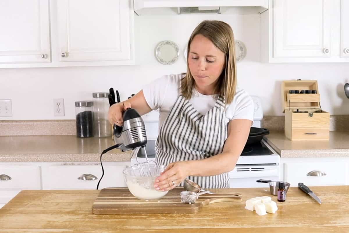 Whipping the body butter with a hand mixer.