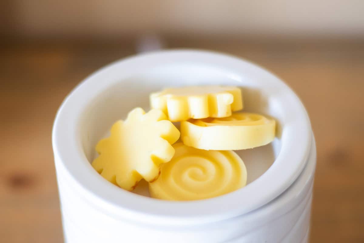 Homemade wax melts in a white electric wax warmer.