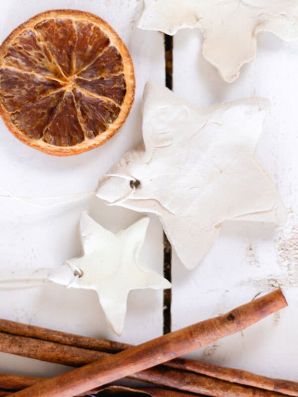 Two diffuser ornaments with a dried orange and cinnamon sticks.