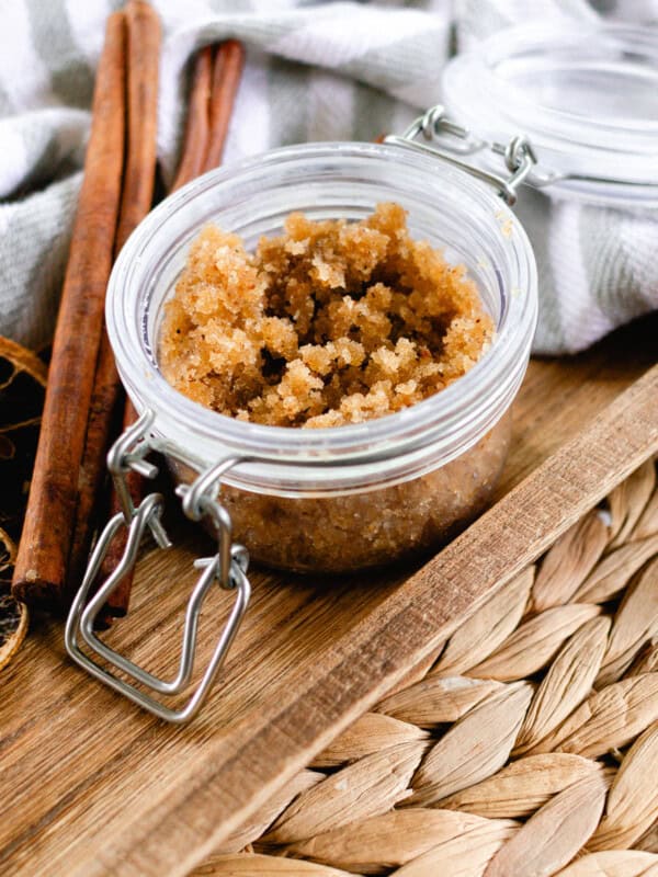 Fall body scrub in a jar with cinnamon sticks.