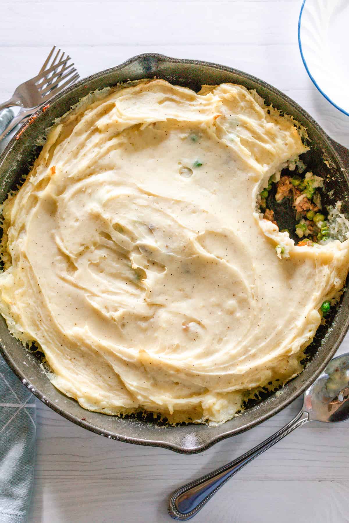 Looking down on a gluten-free shepherd's pie in a cast iron skillet.