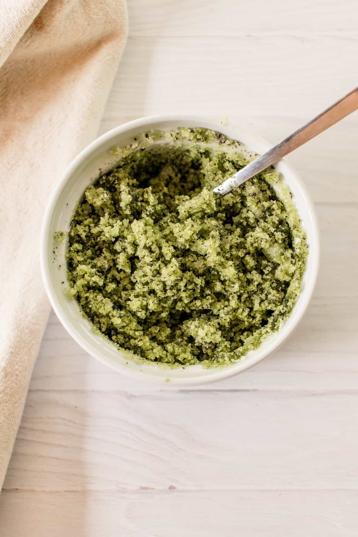 Green tea matcha scrub in a bowl after being stirred.