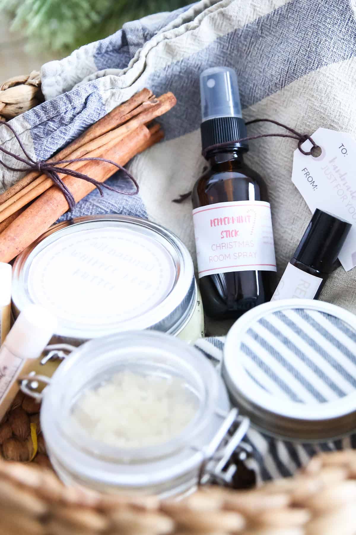 Homemade bath and beauty products in a Christmas gift basket.