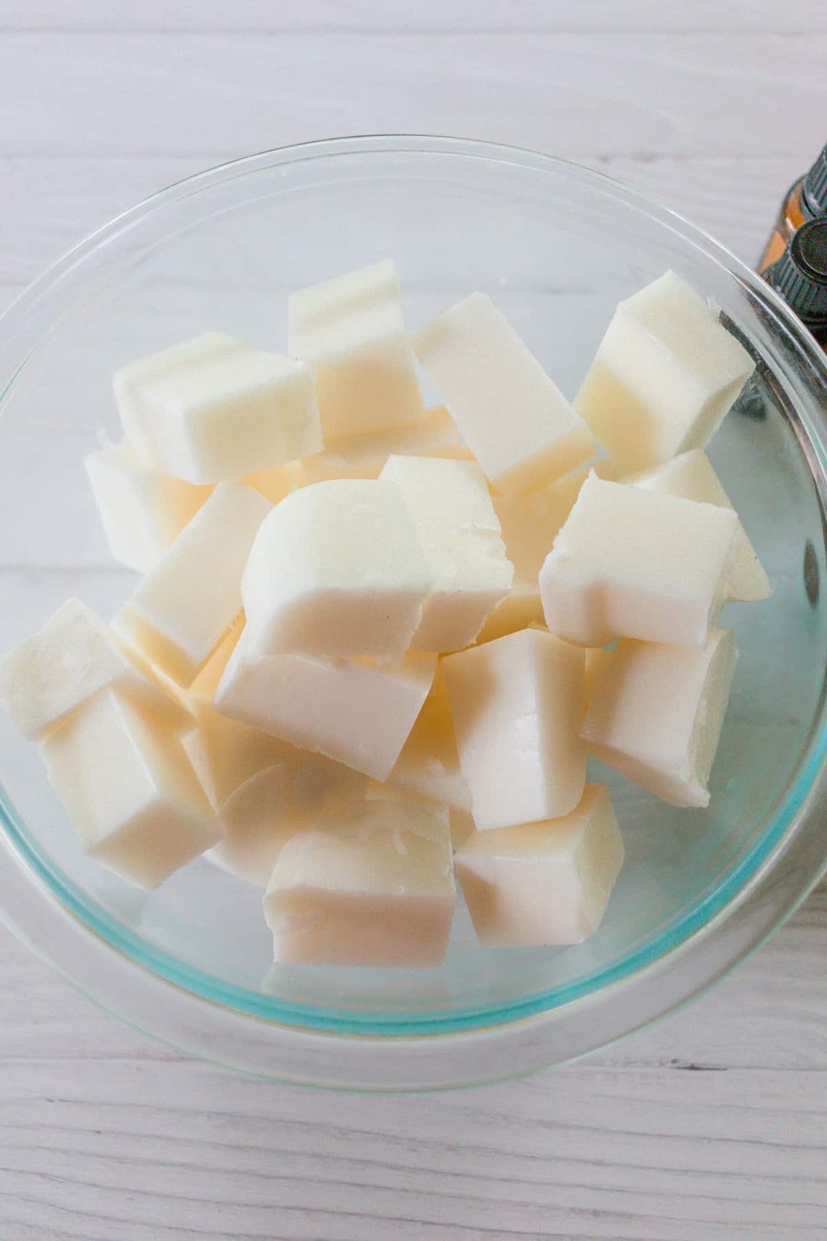 Cubes of soap base in a glass bowl.