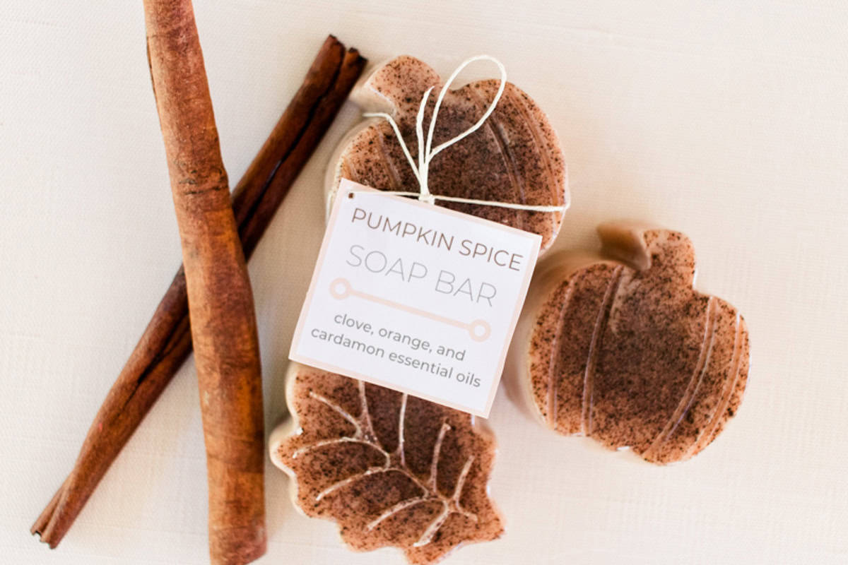 Pumpkin spice soap bars with cinnamon sticks and a label.