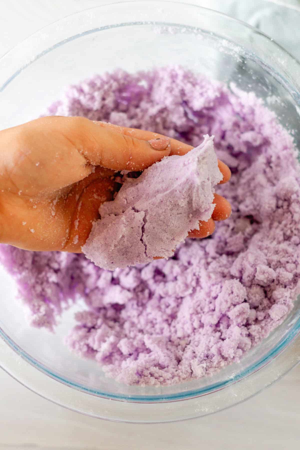 Squeezing the ingredients in the palm of my hand to check the texture. 