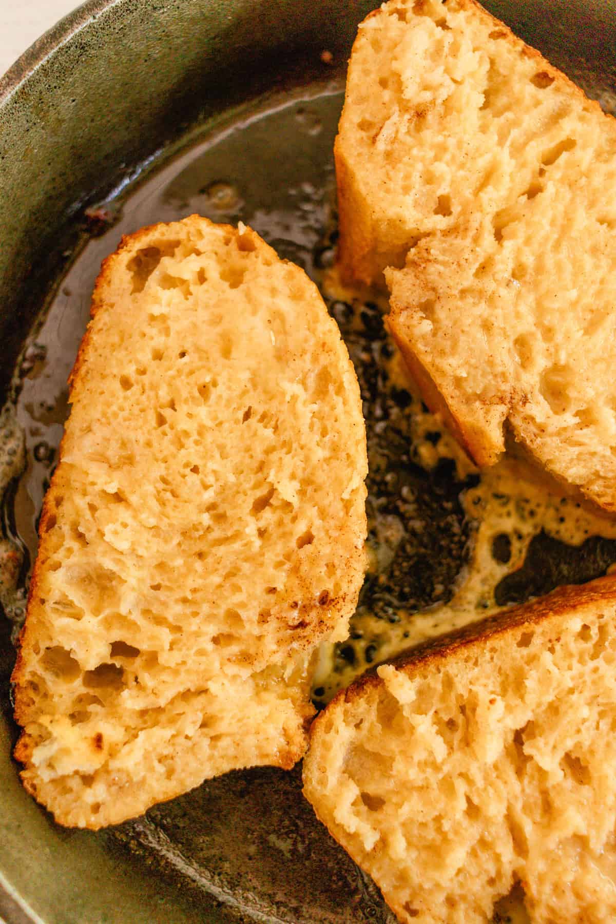 Frying french toast in a cast iron skillet.