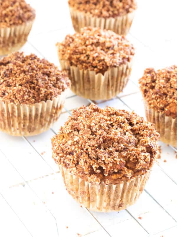 Several pumpkin muffins cooling on a wire cooling rack.