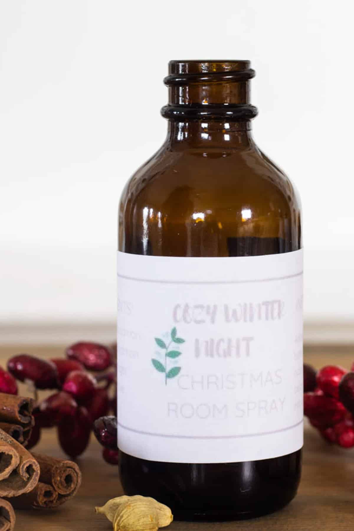 A bottle of holiday room spray without the lid on.