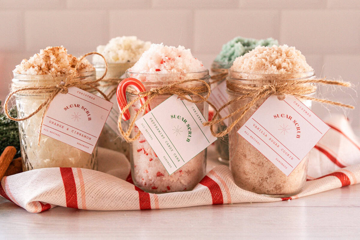 Christmas sugar scrubs with handmade labels tied to the top.