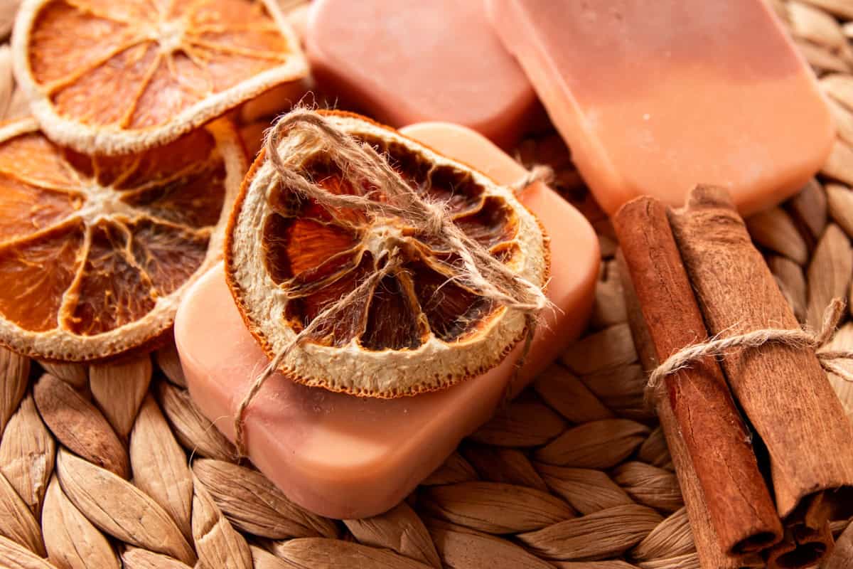 Orange vanilla soap with a dried orange slice tied to the top with hemp string.