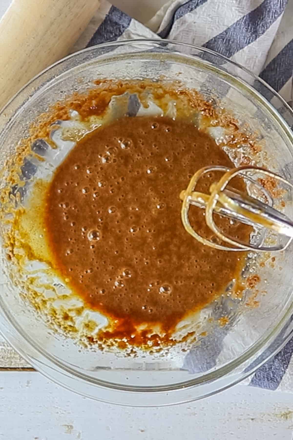 Mixing the wet ingredients for homemade paleo sugar cookies.