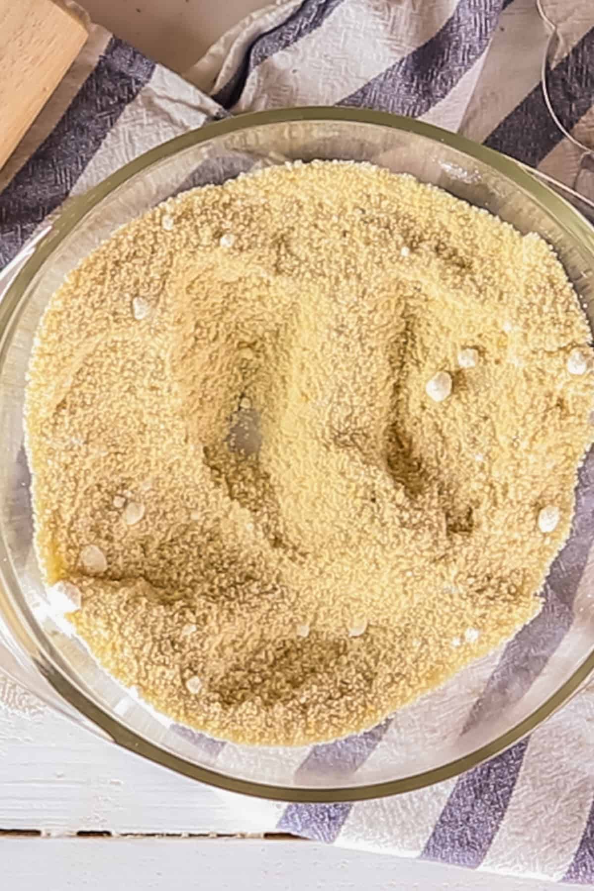 Dry ingredients in a glass mixing bowl.