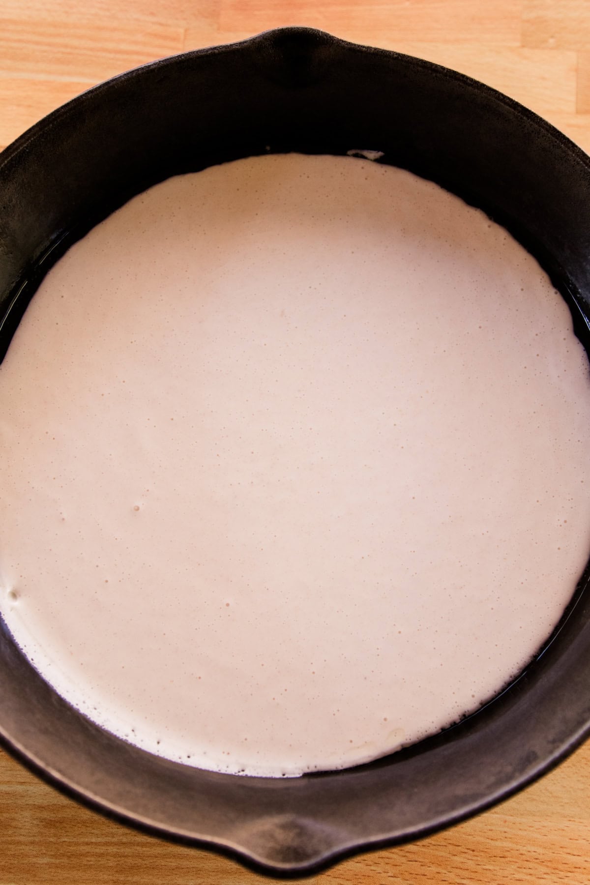 Sourdough starter in a cast iron skillet.
