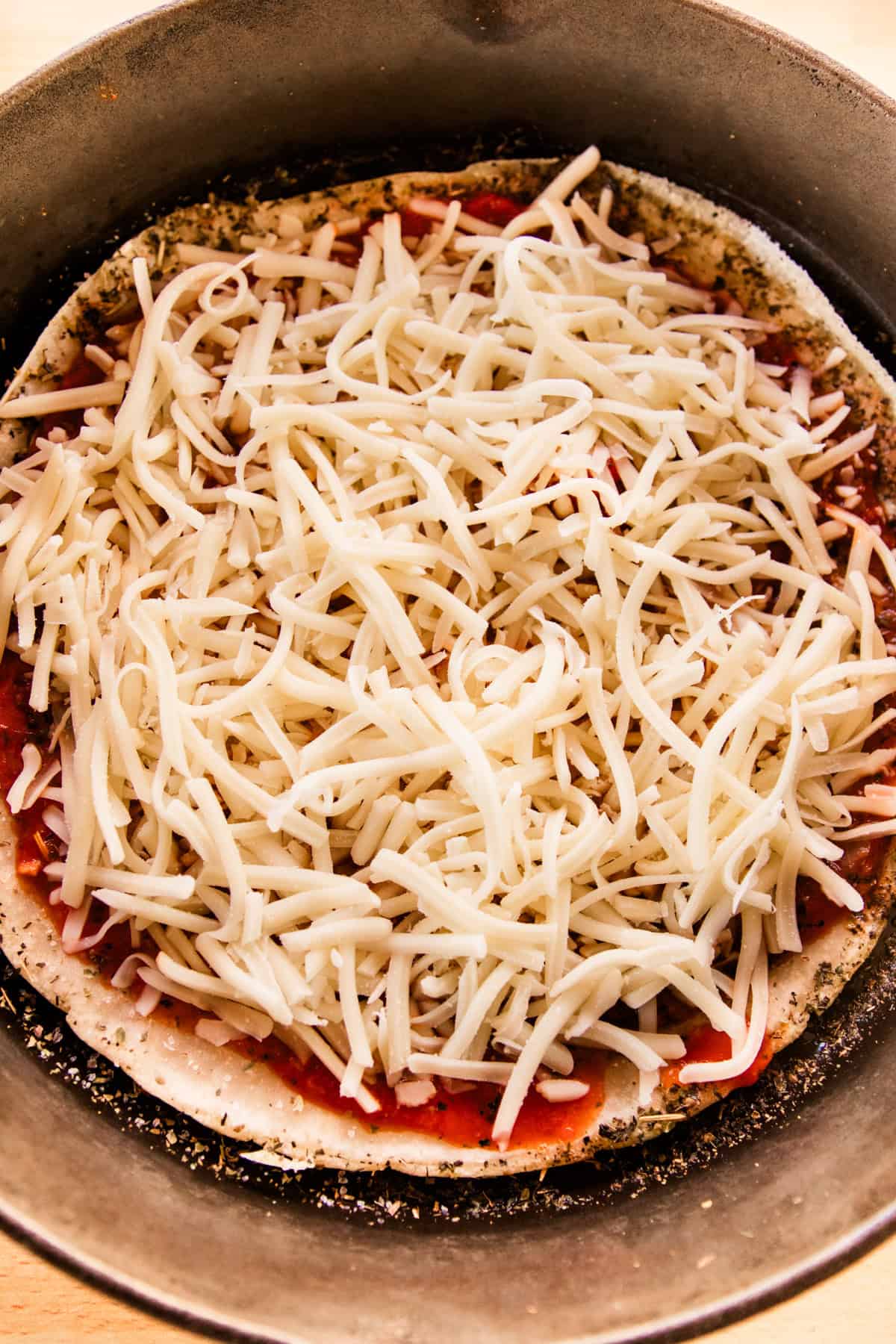 Sourdough pizza crust with sauce and cheese.
