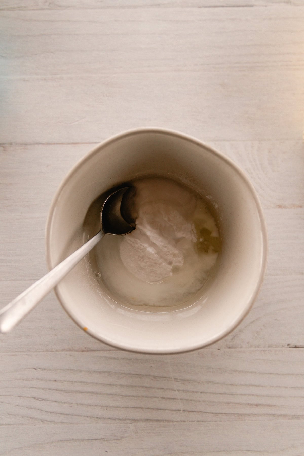 Ingredients in a bowl with a spoon.