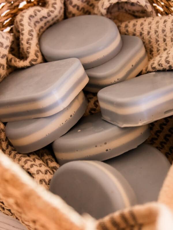 A basket full of layered peppermint soap bars.