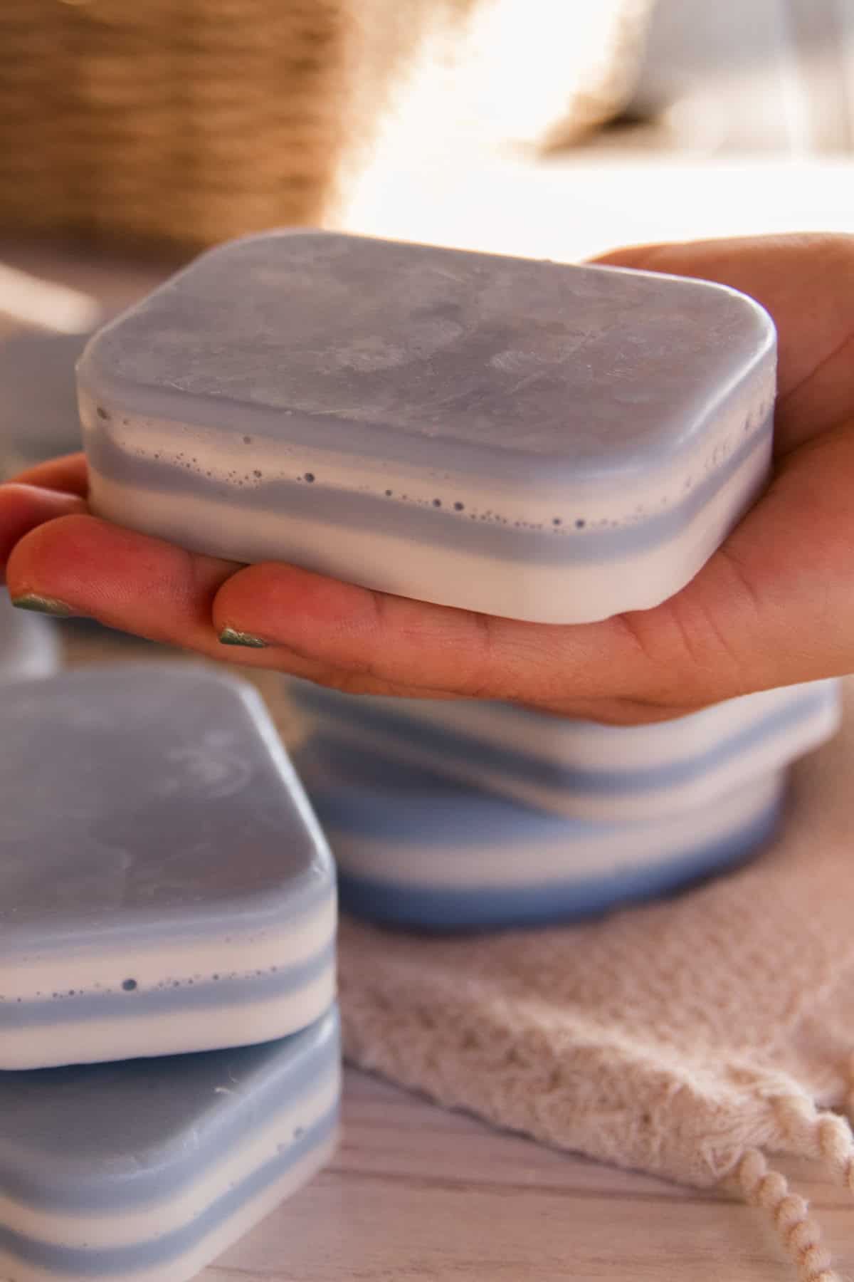 Holding a bar of peppermint layer soap.