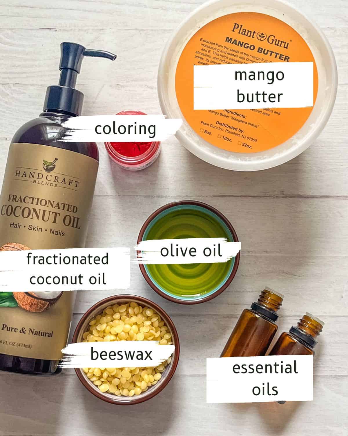 DIY lip gloss ingredients on a white table.