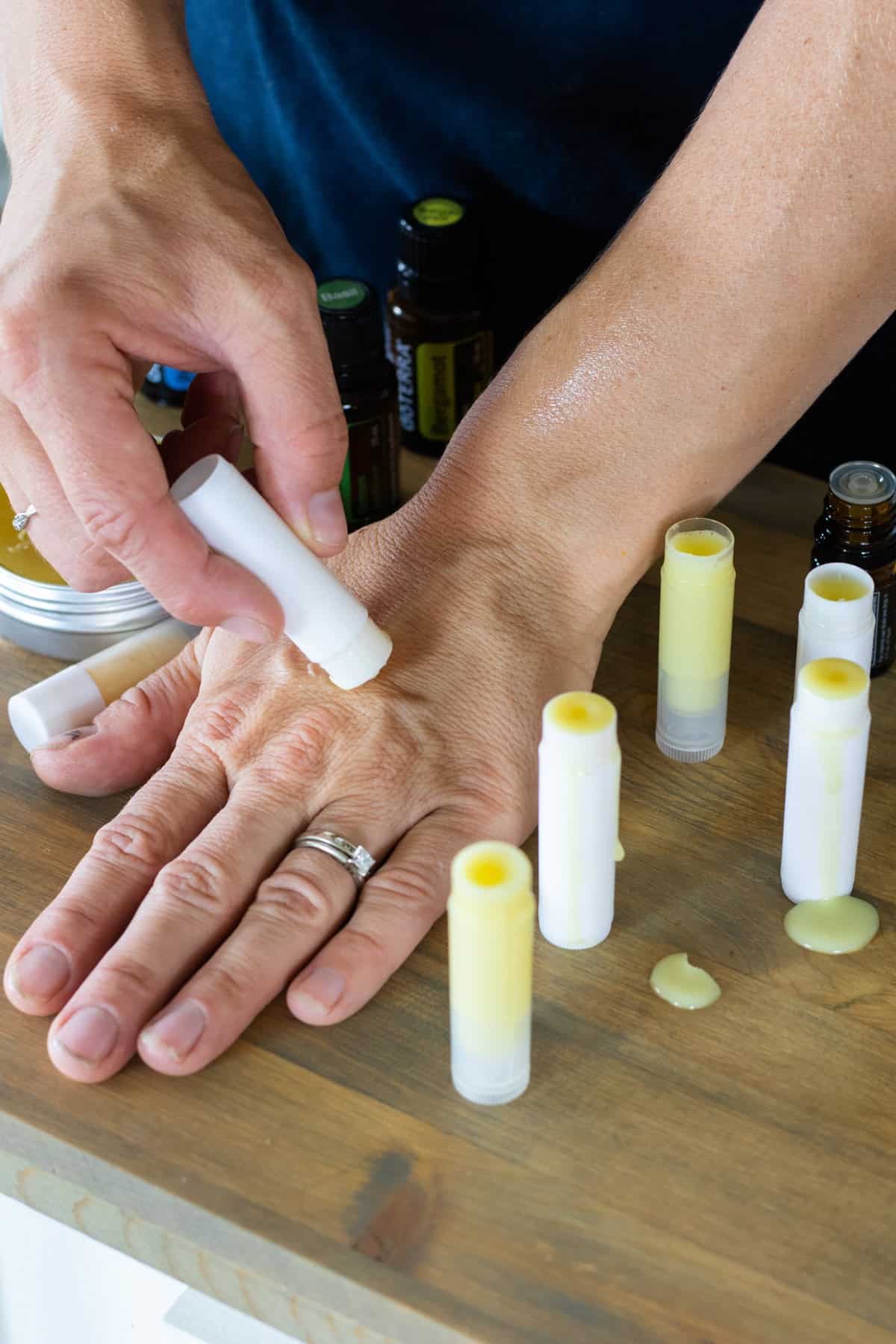 Applying the homemade anti itch cream to a bug bite on the back of my hand. 
