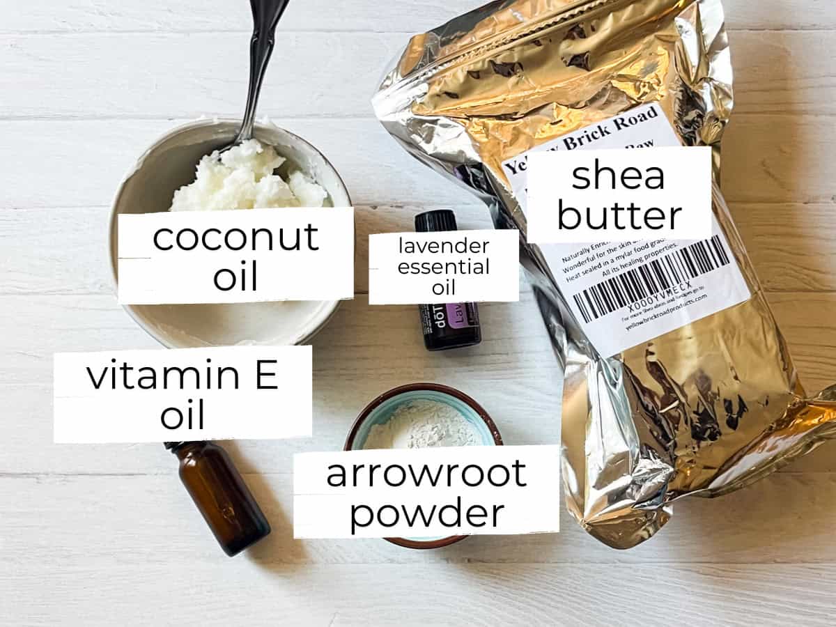Shea butter lotion ingredients labeled on a white table. 