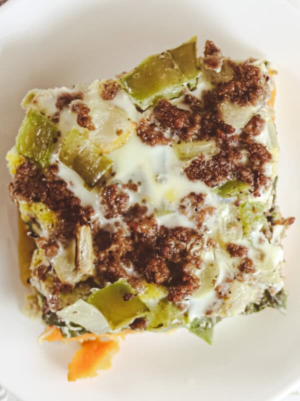 A slice of sweet potato breakfast casserole on a white plate.